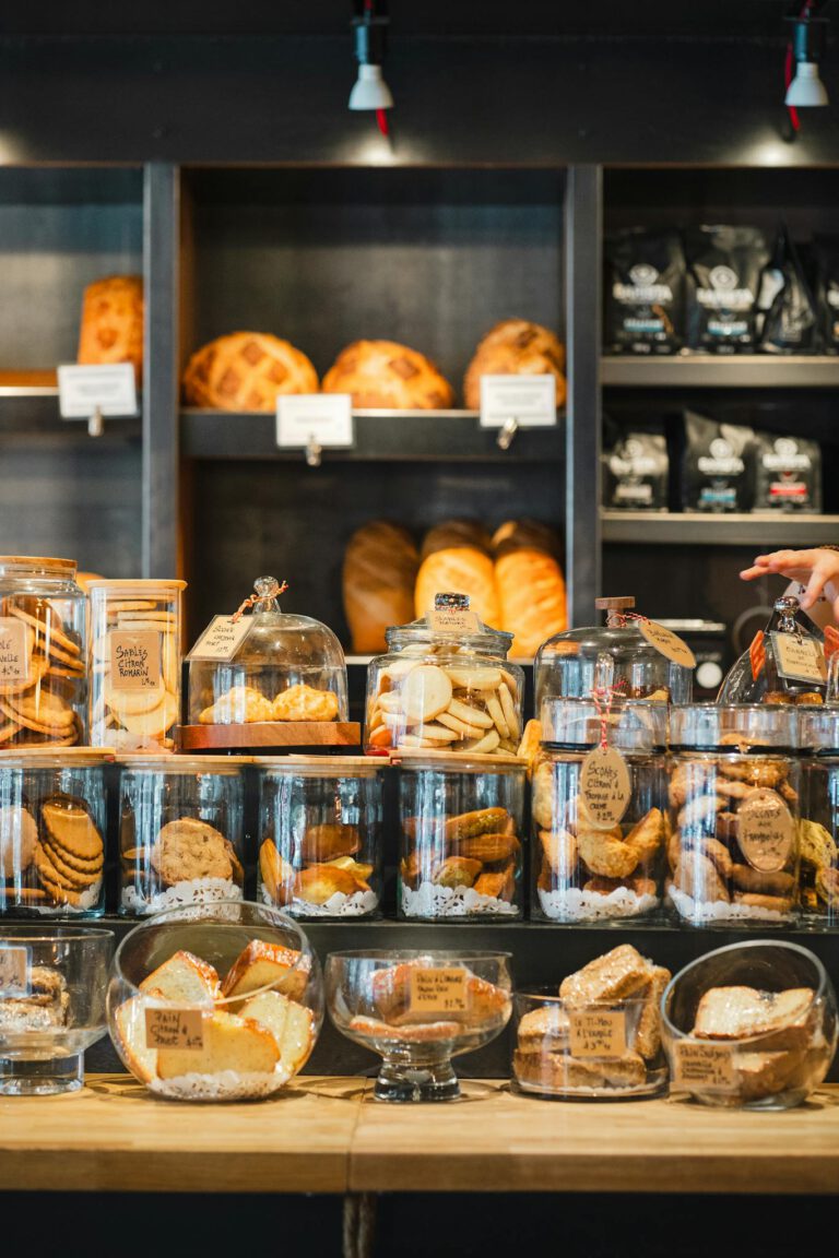Delicious assortment of bread and pastries on display in a cozy bakery setting.